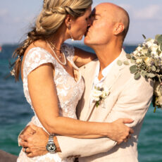 A bride and groom share an intimate moment during their wedding photoshoot.