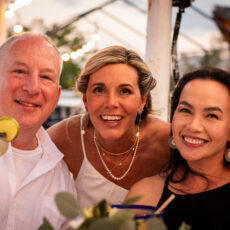 The bride celebrating with friends at her wedding reception on the rooftop at La Sirena Puerto Morelos.