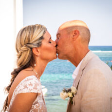 Bride and groom share their first kiss as a married couple on the rooftop of La Sirena Puerto Morelos.